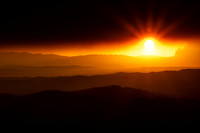 Sunset under a plume of forest fire smoke